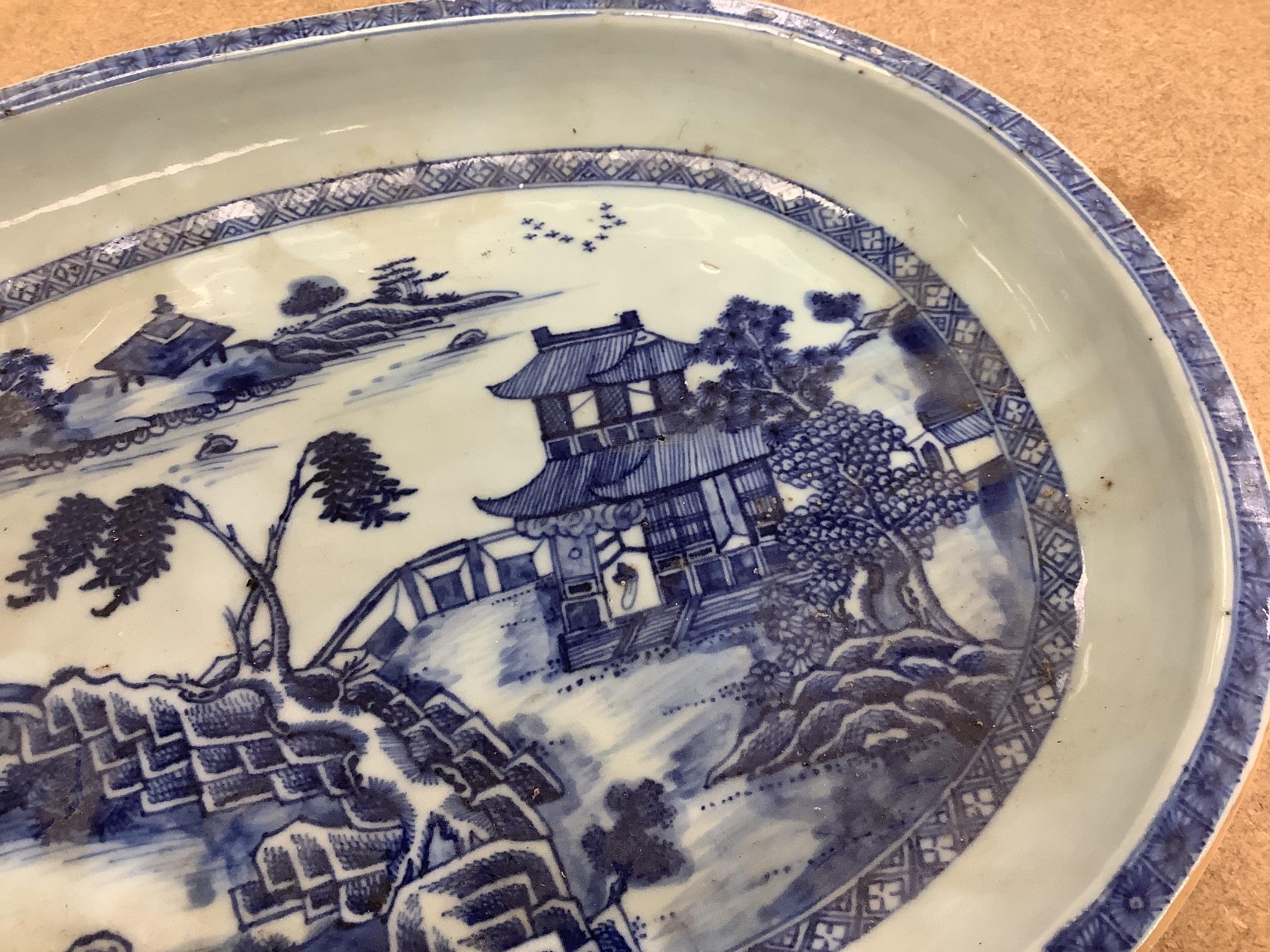 An 18th century Chinese export oval blue and white dish, 32cm.